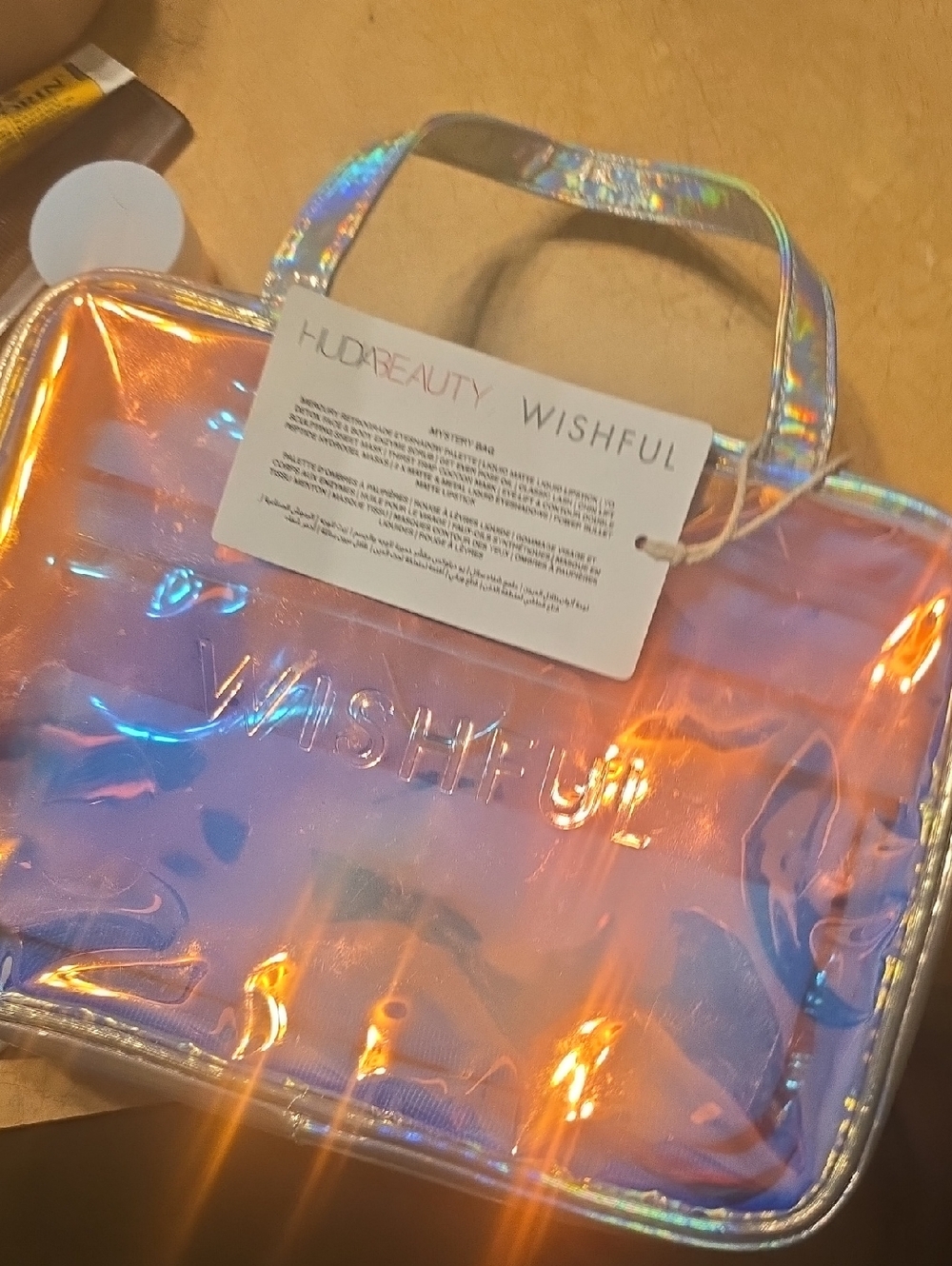 HUDA BEAUTY Iridescent Holographic Cosmetic Bag - Pink, Blue, Orange Shine
